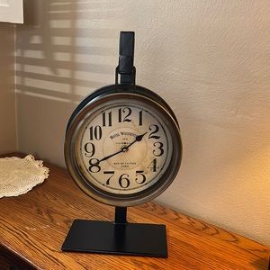 Mercana Metal desk clock on stand. Battery operated. Two pieces. Brown metal